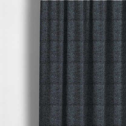 The fabric used to create these made-to-measure curtains is a dark, heavyweight woven fabric with a deep slate and charcoal marl pattern. The dense bouclé weave creates a low-contrast, pebbled texture with a uniform, dark grey appearance.