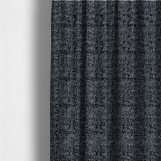 The fabric used to create these made-to-measure curtains is a dark, heavyweight woven fabric with a deep slate and charcoal marl pattern. The dense bouclé weave creates a low-contrast, pebbled texture with a uniform, dark grey appearance.