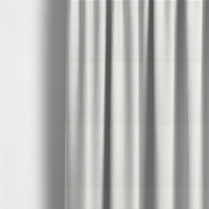 The fabric used to create these made-to-measure curtains is a off-white upholstery fabric. The material features a chunky, nubby boucle texture arranged in a soft horizontal and vertical grid pattern, creating a cosy and dimensional tactile surface.