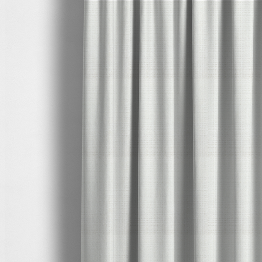 The fabric used to create these made-to-measure curtains is a off-white upholstery fabric. The material features a chunky, nubby boucle texture arranged in a soft horizontal and vertical grid pattern, creating a cosy and dimensional tactile surface.