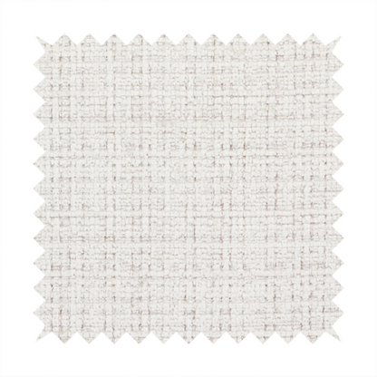 A cream and oatmeal-toned fabric. The material features a chunky, multi-tonal boucle weave with a distinct grid pattern and organic snubbed yarns, creating a dimensional and rustic look.