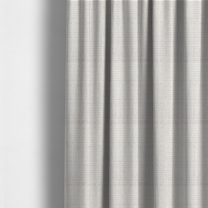 The fabric used to create these made-to-measure curtains is a cream and oatmeal-toned fabric. The material features a chunky, multi-tonal boucle weave with a distinct grid pattern and organic snubbed yarns, creating a dimensional and rustic look.