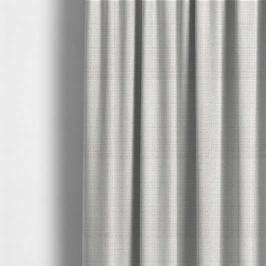 The fabric used to create these made-to-measure curtains is a cream and oatmeal-toned fabric. The material features a chunky, multi-tonal boucle weave with a distinct grid pattern and organic snubbed yarns, creating a dimensional and rustic look.
