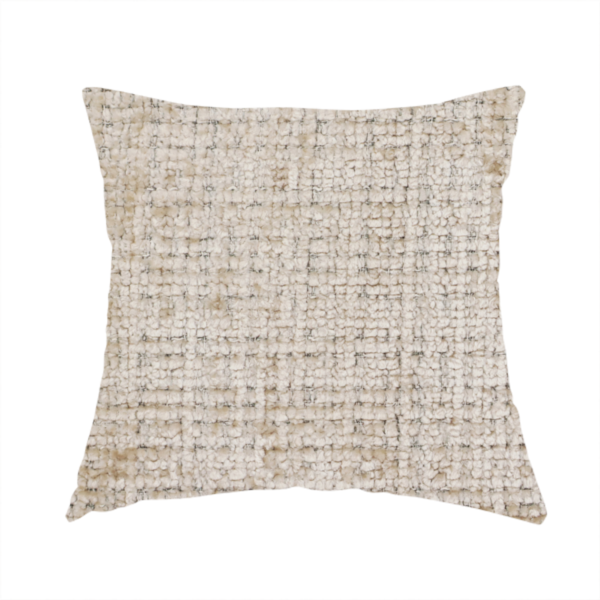 The fabric used to create this handmade cushion is a beige and sand-toned upholstery fabric. The material features a chunky, multi-layered boucle texture with a prominent architectural grid pattern and a mix of warm tan and ivory yarns.