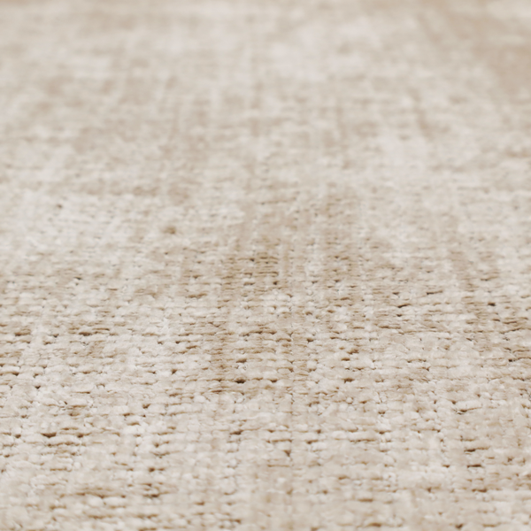 A beige and sand-toned upholstery fabric. The material features a chunky, multi-layered boucle texture with a prominent architectural grid pattern and a mix of warm tan and ivory yarns.