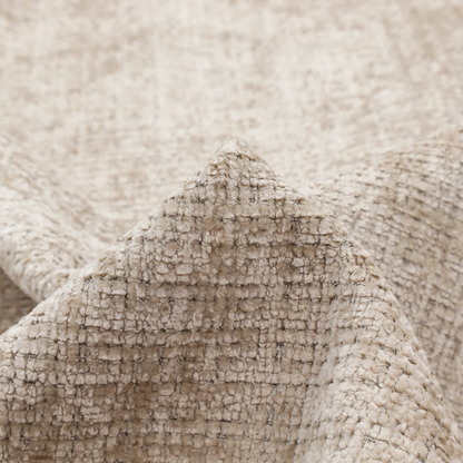 A beige and sand-toned upholstery fabric. The material features a chunky, multi-layered boucle texture with a prominent architectural grid pattern and a mix of warm tan and ivory yarns.