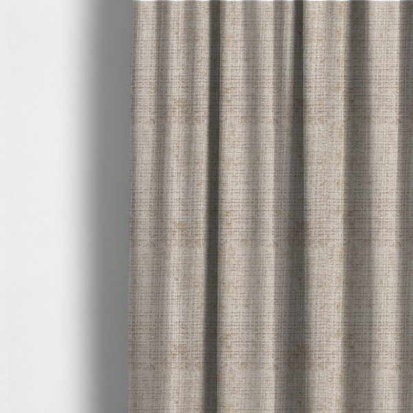 The fabric used to create these made-to-measure curtains is a beige and sand-toned upholstery fabric. The material features a chunky, multi-layered boucle texture with a prominent architectural grid pattern and a mix of warm tan and ivory yarns.