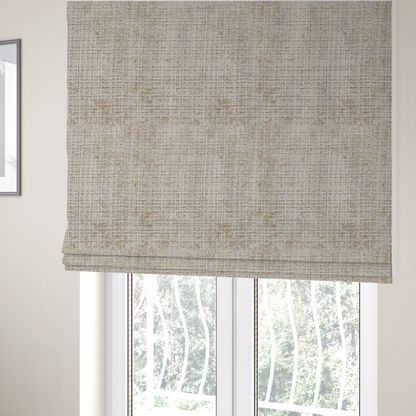 The fabric used to create these Roman blinds is a beige and sand-toned upholstery fabric. The material features a chunky, multi-layered boucle texture with a prominent architectural grid pattern and a mix of warm tan and ivory yarns.