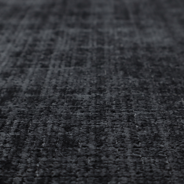 A dark charcoal upholstery fabric. The material features a heavy boucle texture with a prominent, recessed grid pattern, creating a rich, tactile surface with deep shadows and sophisticated dark grey tones.