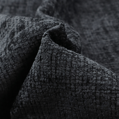 A dark charcoal upholstery fabric. The material features a heavy boucle texture with a prominent, recessed grid pattern, creating a rich, tactile surface with deep shadows and sophisticated dark grey tones.