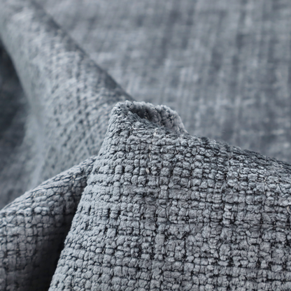 A slate blue and grey textured boucle fabric with a dense, dimensional grid weave.