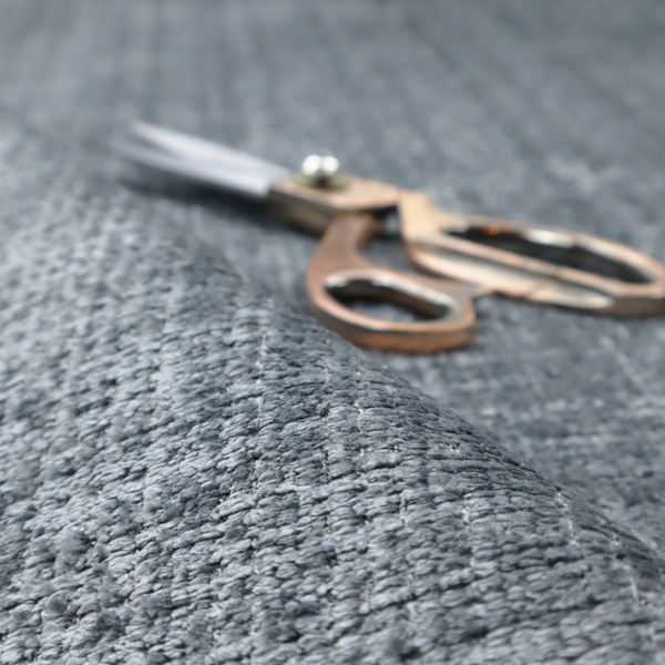 A slate blue and grey textured boucle fabric with a dense, dimensional grid weave.