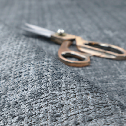 A slate blue and grey textured boucle fabric with a dense, dimensional grid weave.