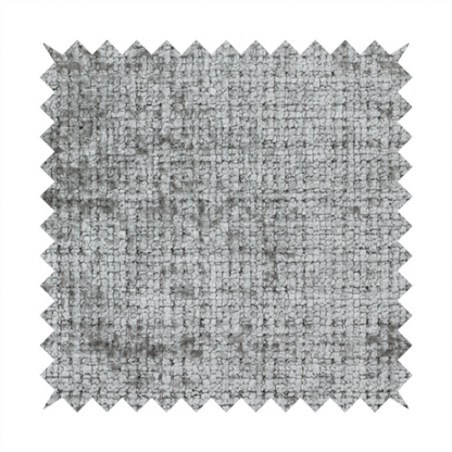 A silver-grey textured boucle fabric with a dimensional grid weave and mottled grey accents.