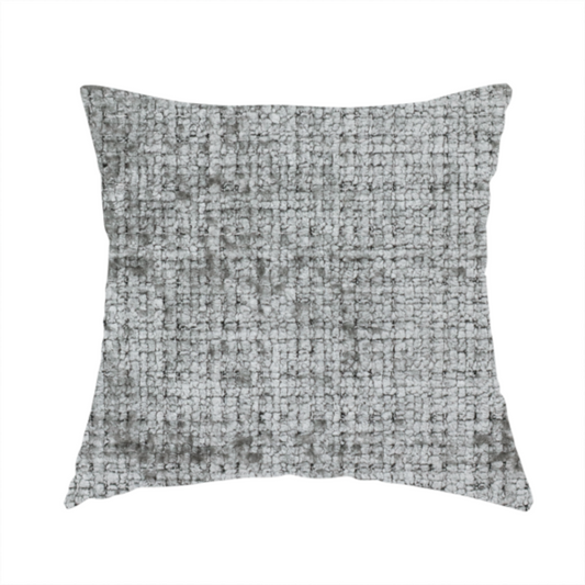 The fabric used to create this handmade cushion is a silver-grey textured boucle fabric with a dimensional grid weave and mottled grey accents.