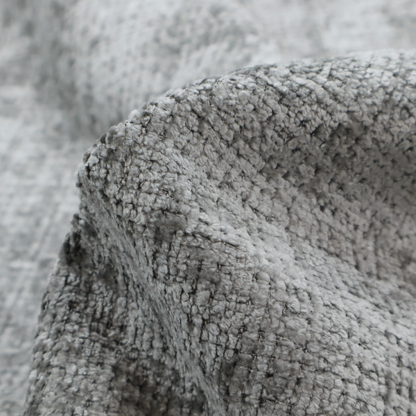A silver-grey textured boucle fabric with a dimensional grid weave and mottled grey accents.