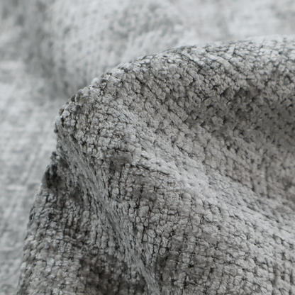 A silver-grey textured boucle fabric with a dimensional grid weave and mottled grey accents.