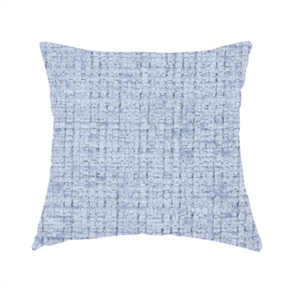 The fabric used to create these handmade cushions is a Scanno weave upholstery fabric in an Ice Blue shade, featuring a textured, woven pattern with small, grid-like interlocking threads.
