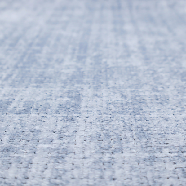 A Scanno weave upholstery fabric in an Ice Blue shade, featuring a textured, woven pattern with small, grid-like interlocking threads.