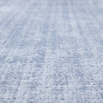 A Scanno weave upholstery fabric in an Ice Blue shade, featuring a textured, woven pattern with small, grid-like interlocking threads.