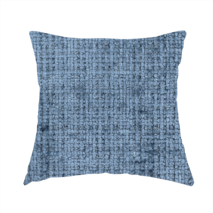 The fabric used to create these handmade cushions is a Scanno Weave upholstery fabric in a medium blue shade, featuring a detailed, woven texture with an interlocking grid pattern.