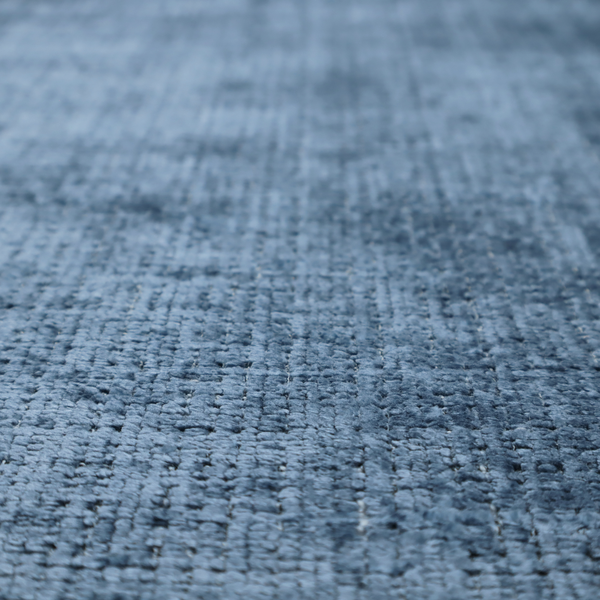 Scanno Weave upholstery fabric in a medium blue shade, featuring a detailed, woven texture with an interlocking grid pattern.
