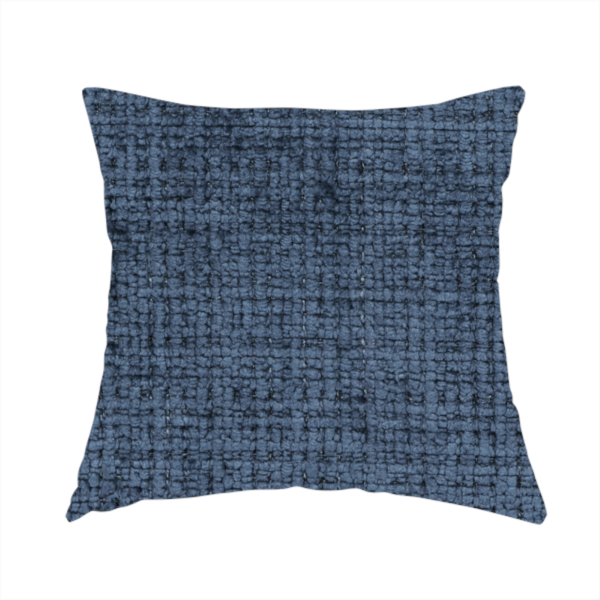 The fabric used to create these handmade cushions is a Scanno Weave upholstery fabric in a deep, dark blue shade, showcasing a detailed, woven texture with an interlocking grid pattern.