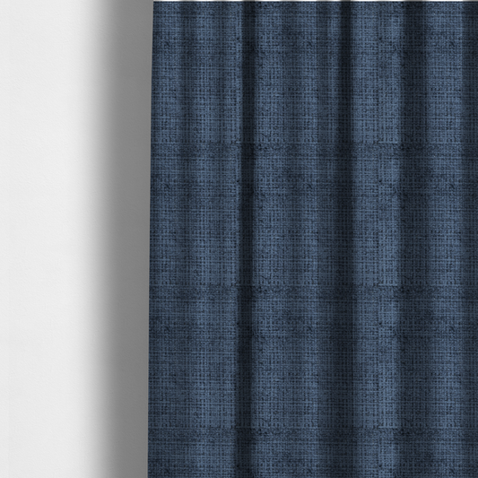 The fabric used to create these made-to-measure curtains is a Scanno Weave upholstery fabric in a deep, dark blue shade, showcasing a detailed, woven texture with an interlocking grid pattern.