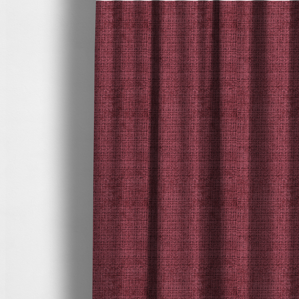 The fabric used to create these made-to-measure curtains is a Scanno Weave upholstery fabric in a deep red shade, showcasing a detailed, woven texture with an interlocking grid pattern.