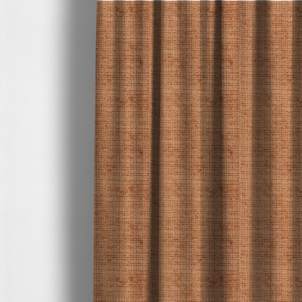 The fabric used to create these made-to-measure curtains is a Scanno Weave upholstery fabric in a warm tan shade, showcasing a detailed, woven texture with an interlocking grid pattern.