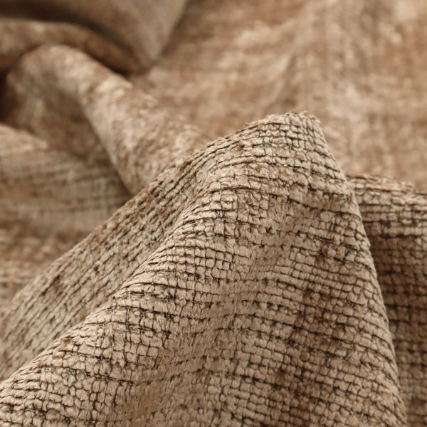 Scanno Weave upholstery fabric in a warm beige shade, showcasing a detailed, woven texture with an interlocking grid pattern.