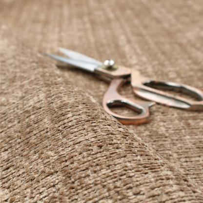 Scanno Weave upholstery fabric in a warm beige shade, showcasing a detailed, woven texture with an interlocking grid pattern.