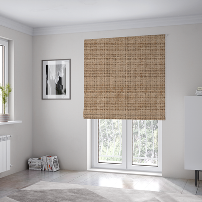 The fabric used to create these Roman blinds is a Scanno Weave upholstery fabric in a warm beige shade, showcasing a detailed, woven texture with an interlocking grid pattern.