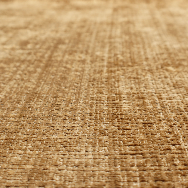 Scanno Weave upholstery fabric in a golden honey shade, showcasing a detailed, woven texture with an interlocking grid pattern.