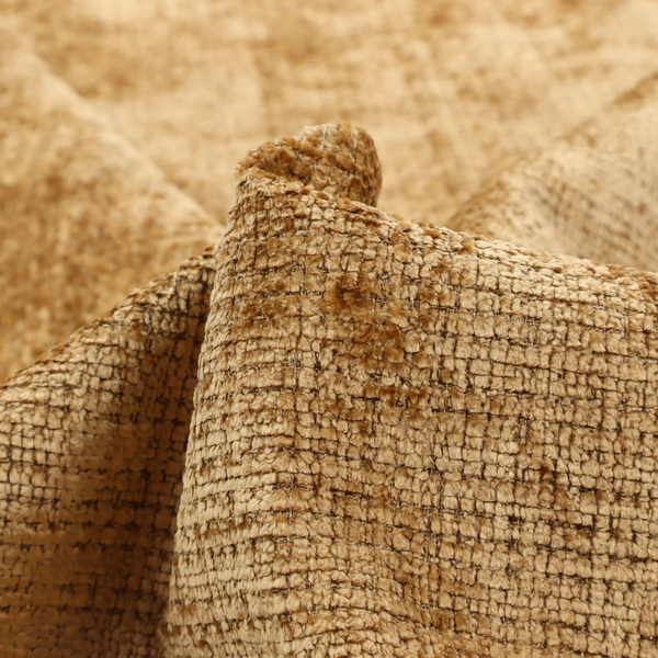 Scanno Weave upholstery fabric in a golden honey shade, showcasing a detailed, woven texture with an interlocking grid pattern.