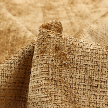 Scanno Weave upholstery fabric in a golden honey shade, showcasing a detailed, woven texture with an interlocking grid pattern.