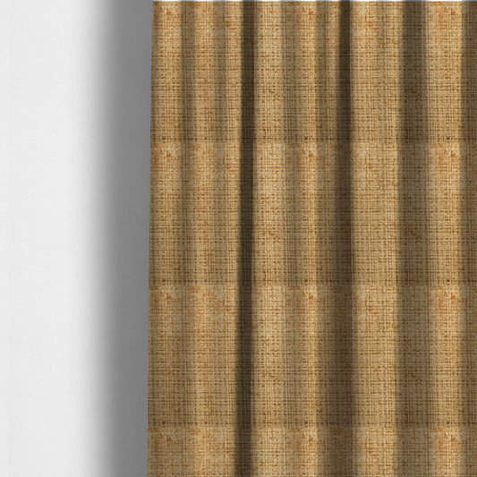 The fabric used to create these made-to-measure curtains is a Scanno Weave upholstery fabric in a golden honey shade, showcasing a detailed, woven texture with an interlocking grid pattern.
