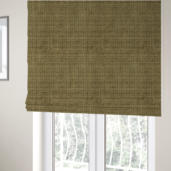 The fabric used to create these Roman blinds is a Scanno Weave upholstery fabric in a muted olive green shade, showcasing a detailed, woven texture with an interlocking grid pattern.