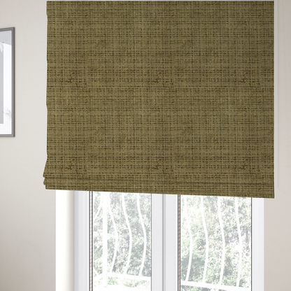 The fabric used to create these Roman blinds is a Scanno Weave upholstery fabric in a muted olive green shade, showcasing a detailed, woven texture with an interlocking grid pattern.