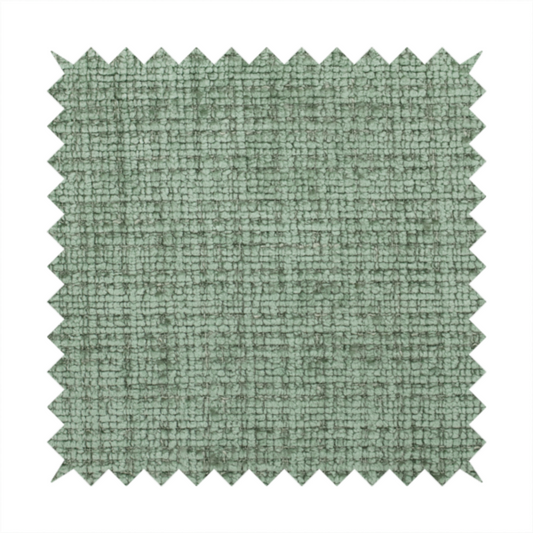 Scanno Weave upholstery fabric in a soft mint green shade, showcasing a detailed, woven texture with an interlocking grid pattern.