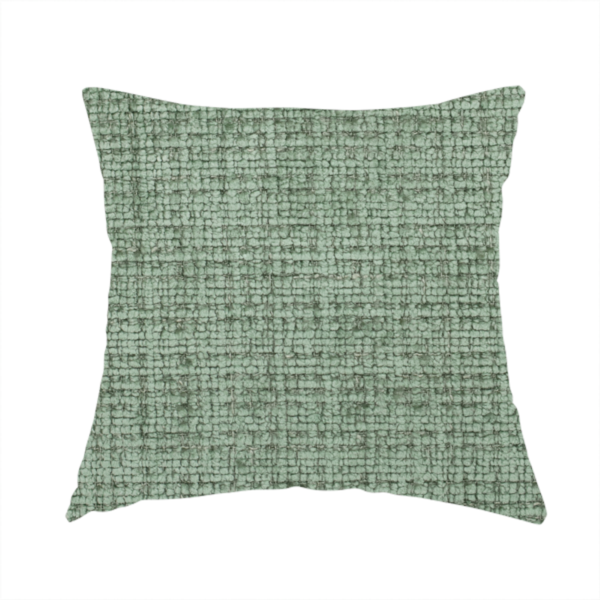 The fabric used to create this handmade cushion is a Scanno Weave upholstery fabric in a soft mint green shade, showcasing a detailed, woven texture with an interlocking grid pattern.