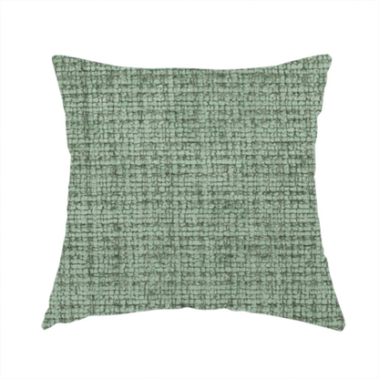 The fabric used to create this handmade cushion is a Scanno Weave upholstery fabric in a soft mint green shade, showcasing a detailed, woven texture with an interlocking grid pattern.