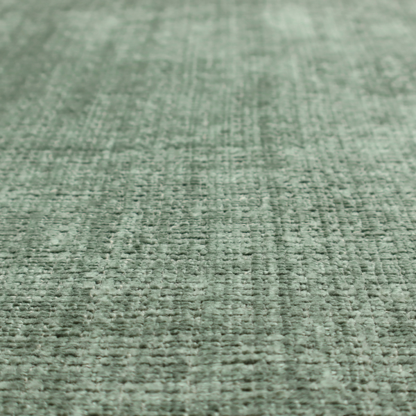 Scanno Weave upholstery fabric in a soft mint green shade, showcasing a detailed, woven texture with an interlocking grid pattern.