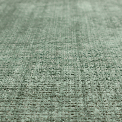 Scanno Weave upholstery fabric in a soft mint green shade, showcasing a detailed, woven texture with an interlocking grid pattern.