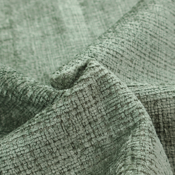 Scanno Weave upholstery fabric in a soft mint green shade, showcasing a detailed, woven texture with an interlocking grid pattern.