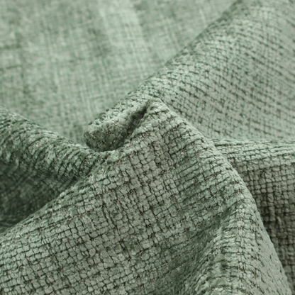 Scanno Weave upholstery fabric in a soft mint green shade, showcasing a detailed, woven texture with an interlocking grid pattern.