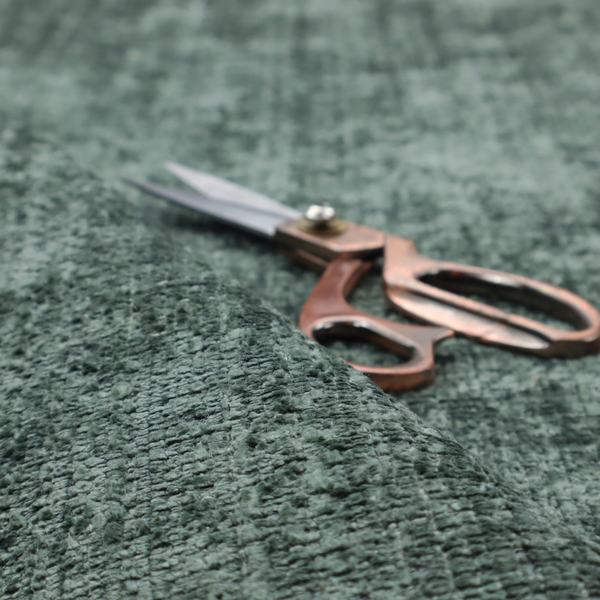 Scanno Weave upholstery fabric in a deep forest green shade, featuring a detailed, woven texture with an interlocking grid pattern.
