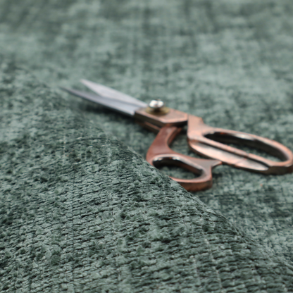 Scanno Weave upholstery fabric in a deep forest green shade, featuring a detailed, woven texture with an interlocking grid pattern.