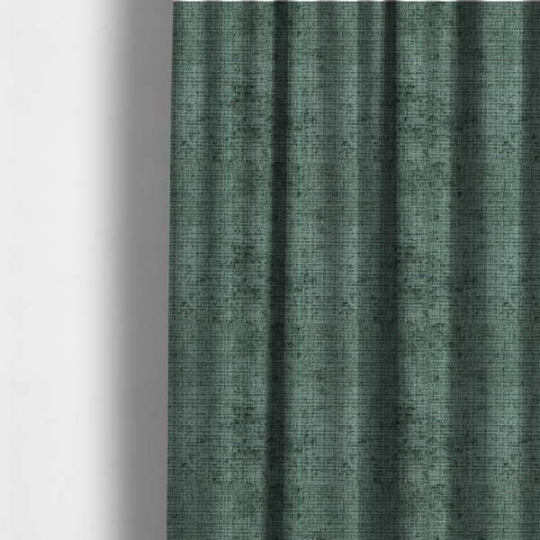 The fabric used to create these made-to-measure curtains is a Scanno Weave upholstery fabric in a deep forest green shade, featuring a detailed, woven texture with an interlocking grid pattern.