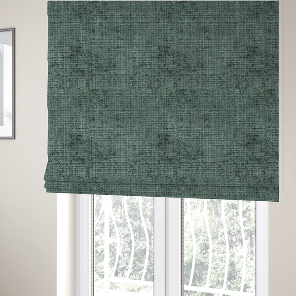 The fabric used to create these Roman blinds is a Scanno Weave upholstery fabric in a deep forest green shade, featuring a detailed, woven texture with an interlocking grid pattern.